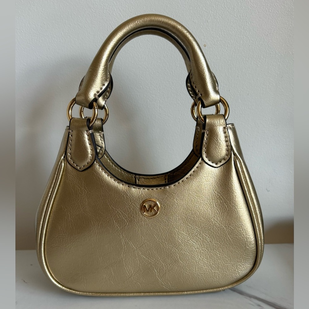 Gold mini bag by Michael Kors